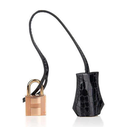 Sleek All-Black Dual Finish Compact Structured Hand Tote With Glossy Scaled Trim, Blush Rose Gold Twist Lock Hardware And Matching Scaled Suspended Metal Padlock Charm